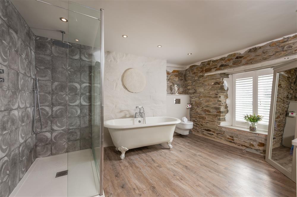 Beach Cottage: Family bathroom with a roll-top bath and large walk-in shower at Beach Cottage and The Lobster Pot, St Agnes