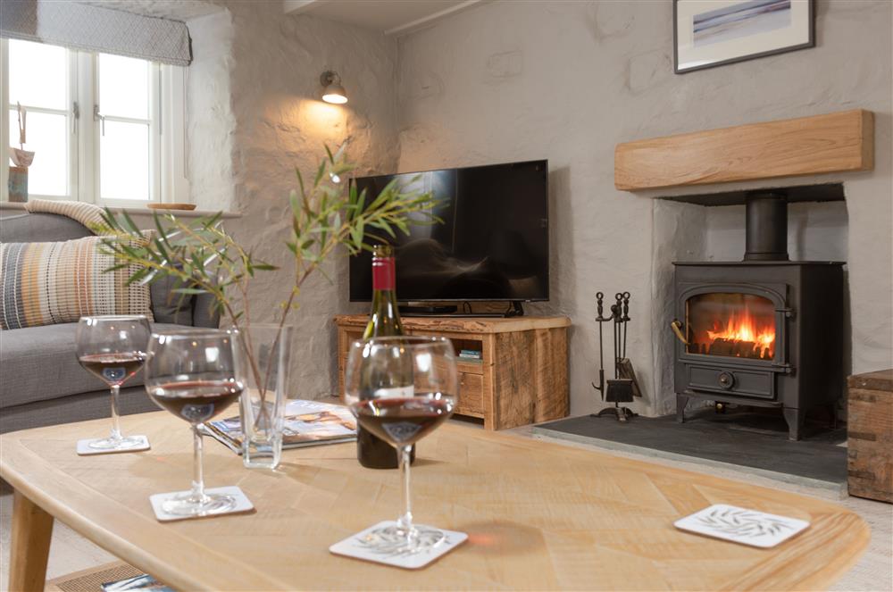 Beach Cottage: Spacious sitting room with a wood burning stove at Beach Cottage and The Lobster Pot, St Agnes