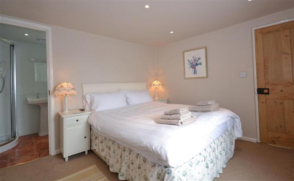 Another view of the master bedroom, showing the door into the en-suite at Beach Cottage in Looe