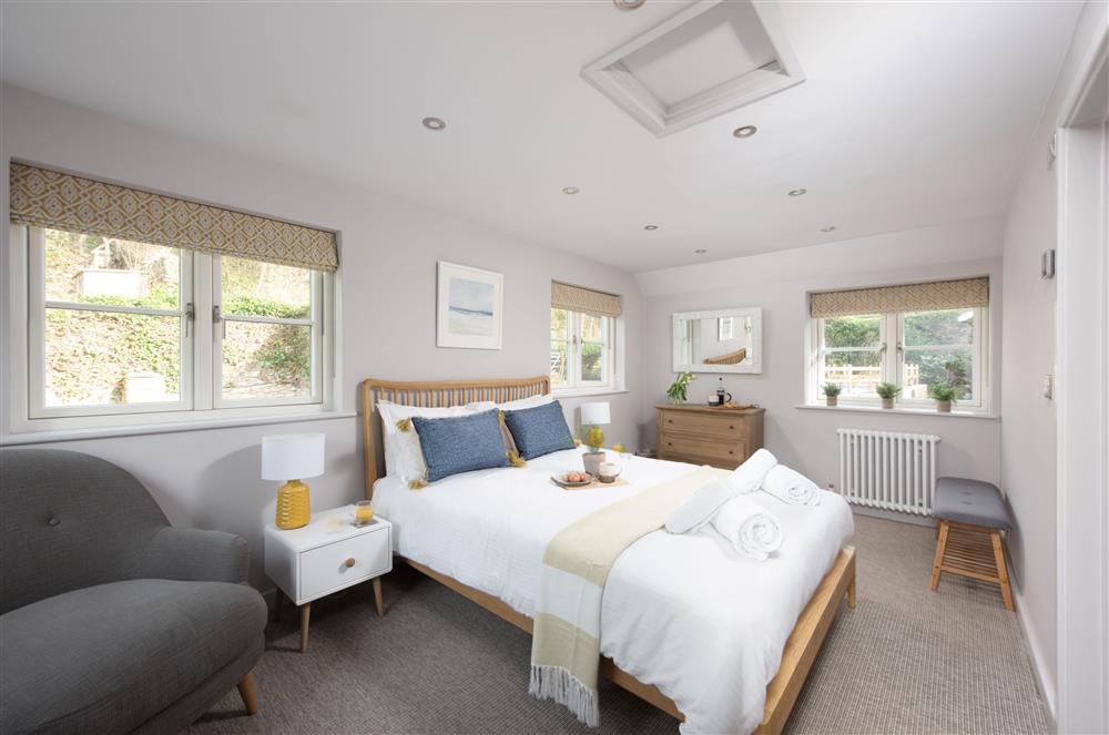 Beach Cottage, Cornwall: Bedroom four with a king-size bed and en-suite shower room at Beach Cottage, St Agnes