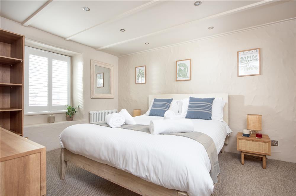Beach Cottage, Cornwall: Bedroom one on the ground floor with a king-size bed and en-suite shower room