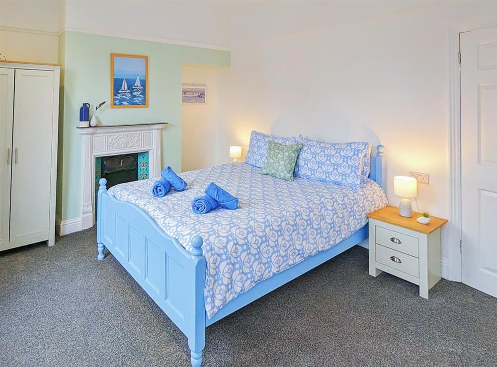 Master bedroom with a king sized bed at Beach Escape in Scarborough, North Yorkshire
