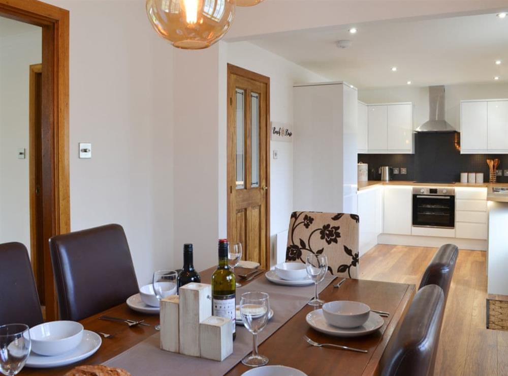 Dining room and adjacent kitchen at Beach House in Nairn, Highlands, Morayshire