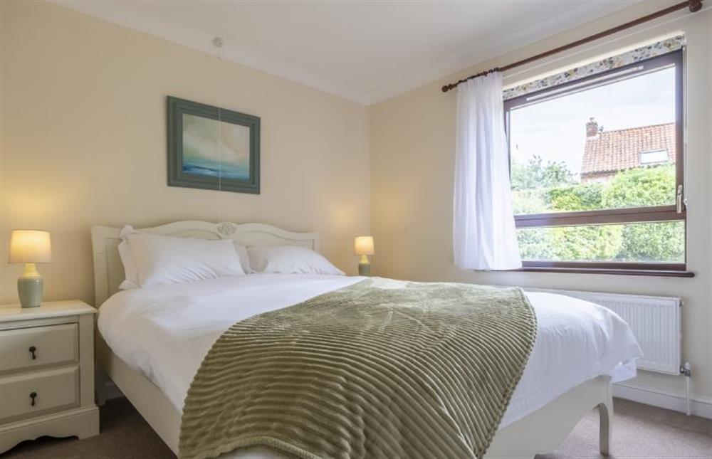 Bedroom one with king-size bed at Beach Retreat, Brancaster near Kings Lynn