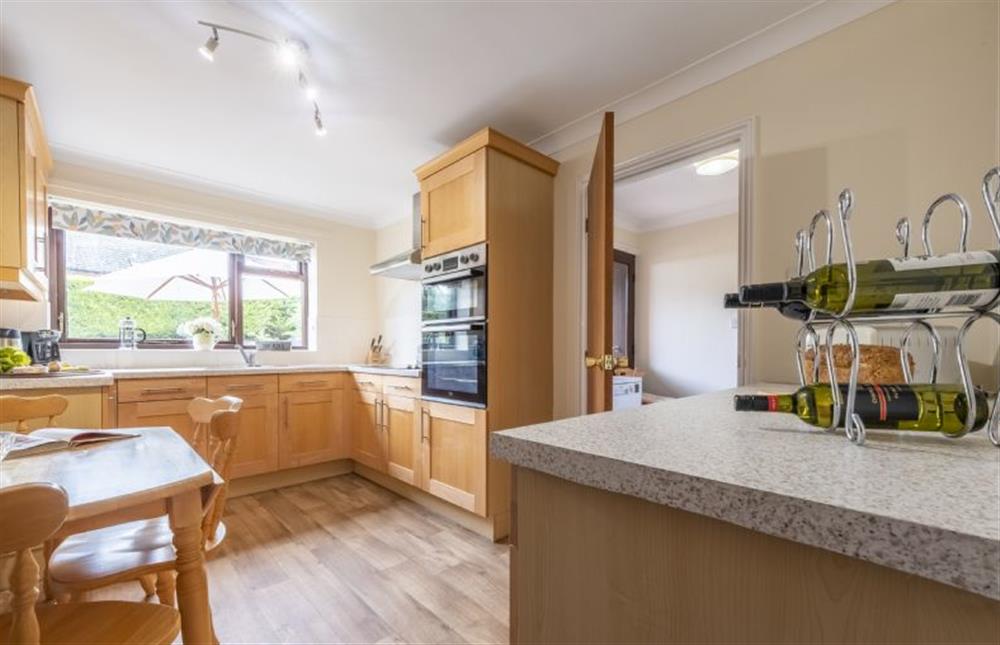 Kitchen with small dining table at Beach Retreat, Brancaster near Kings Lynn