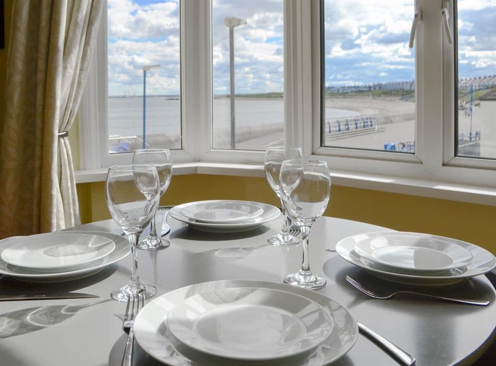 Dining area with wonderful views at Beach View Apartment in Newbiggin-by-the-Sea, Northumberland
