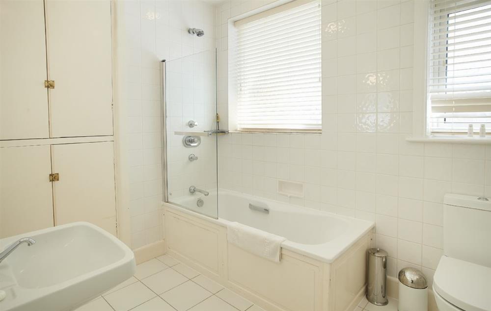 Bathroom with shower over the bath at Beach View, Southbourne