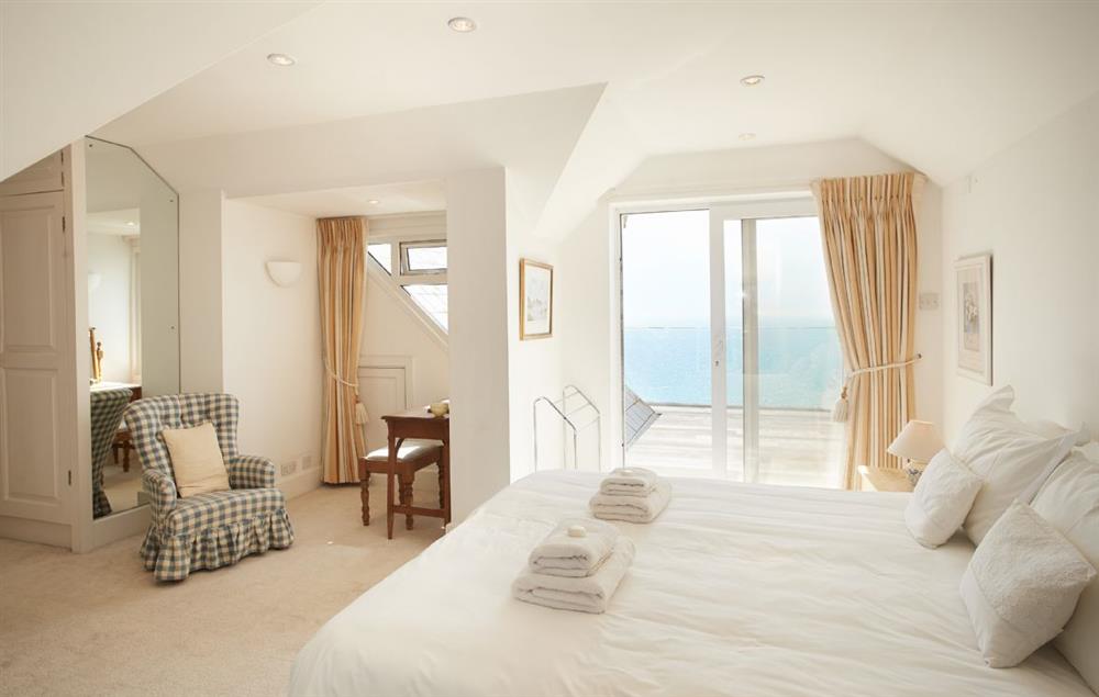 Bedroom with 6’ super king-size zip and link bed with luxury en suite and decking area at Beach View, Southbourne