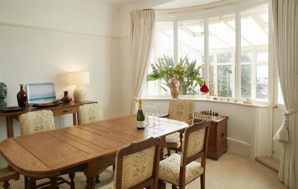 Dining room next to the sitting room with bay window at Beach View, Southbourne