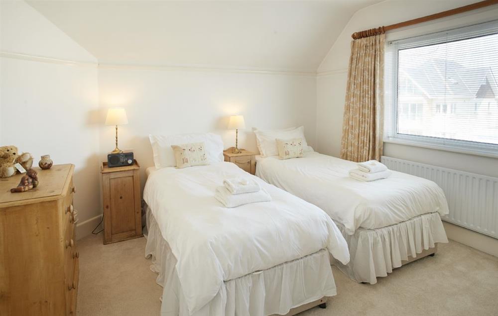 Double bedroom with 3’ zip and link beds which can be converted into a super king size bed on request