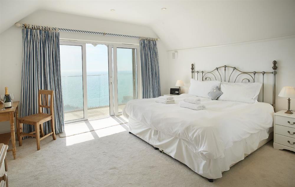 Master bedroom with a 6’6 bed with magnificent views and en suite bathroom at Beach View, Southbourne