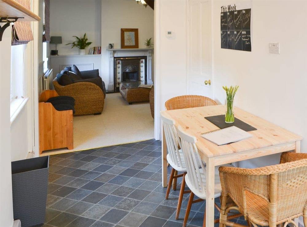Charming dining area adjacent to the living room at Beachcomber Cottage in Newbiggin-by-the-Sea, near Ashington, Northumberland
