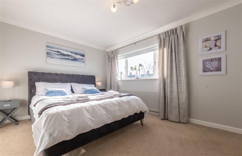 Master bedroom with super-king size bed at Beachcomber, Holme-next-the-Sea near Hunstanton