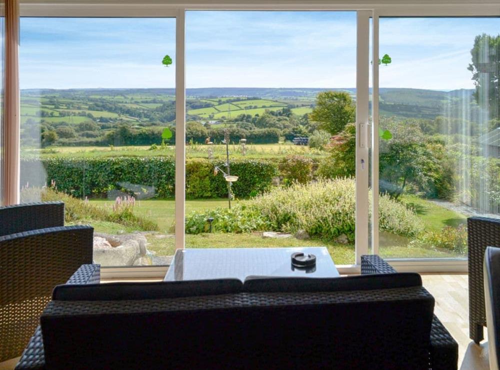 Living room with glorious panoramic countryside views at Beacon Cottage in Bittaford, Nr Ivybridge, Devon., Great Britain