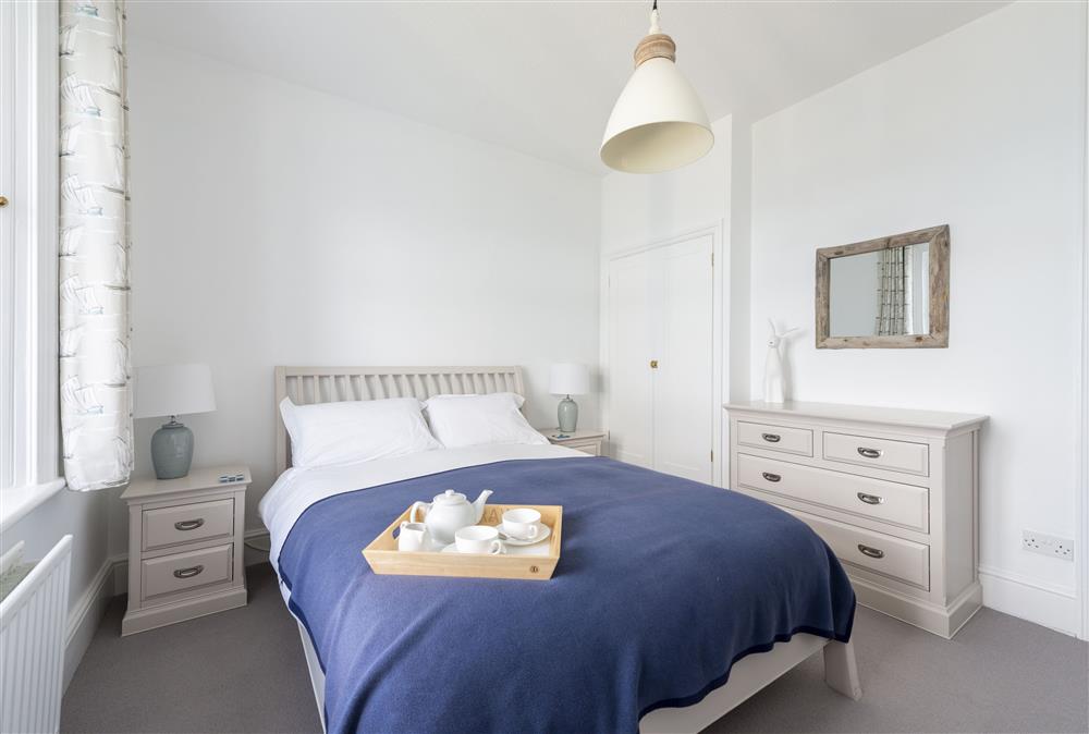 Double bedroom with 5’ bed at Beacon Cottage, Start Point Lighthouse