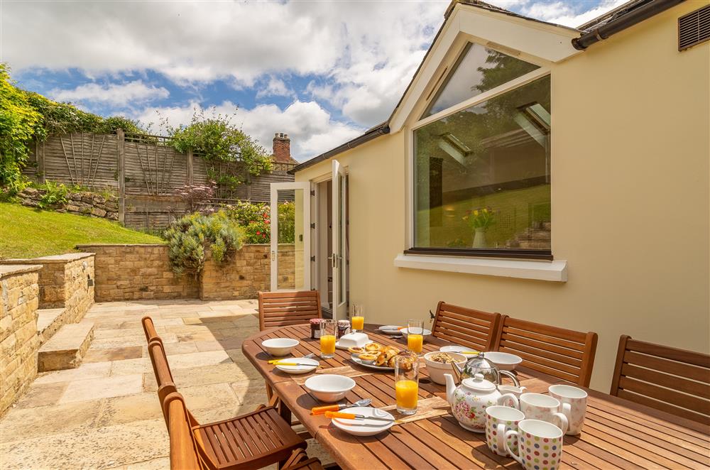 Enjoy breakfast or a barbecue on the spacious patio area at Beadale Cottage, Ampleforth