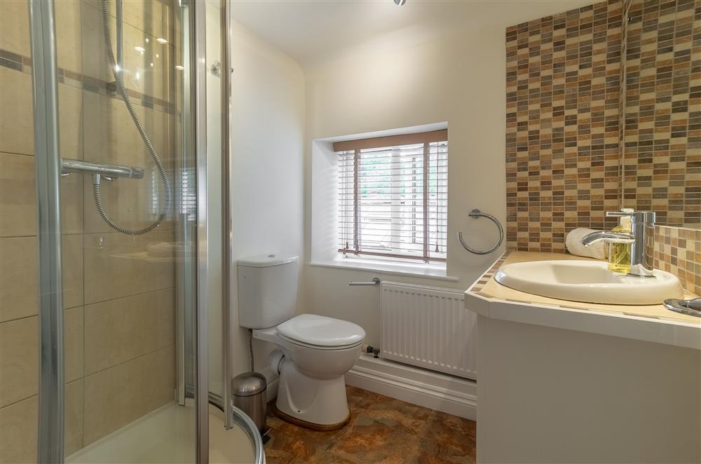 First floor: Family shower room with corner shower, wash basin and WC at Beadale Cottage, Ampleforth