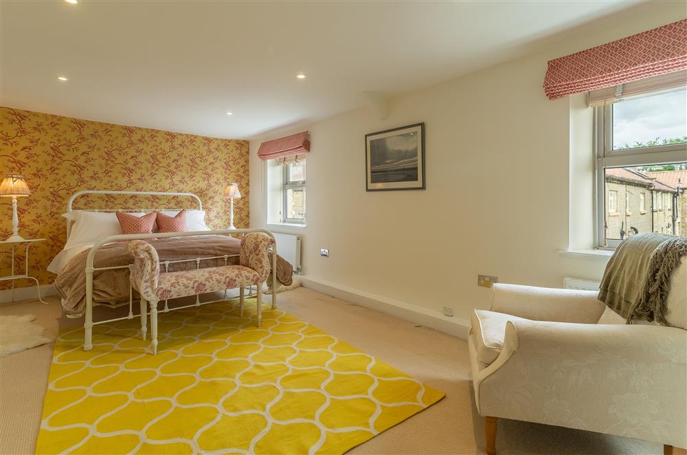 First floor: Master bedroom with double aspect windows and en-suite bathroom at Beadale Cottage, Ampleforth