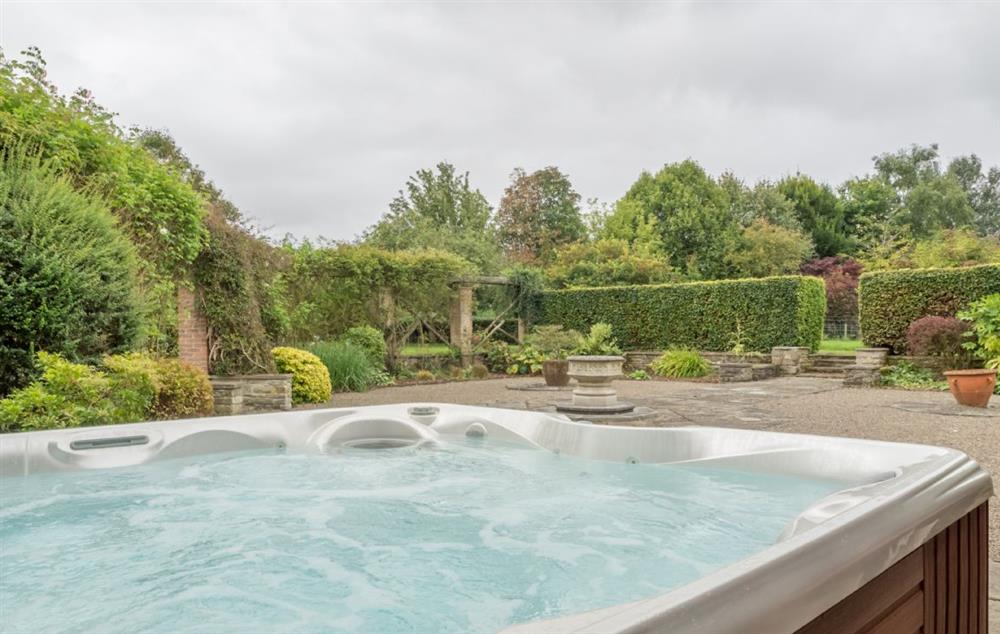 A luxury outdoor hot tub for 6 people at Bearwood House and Cottage, Pembridge, near Leominster