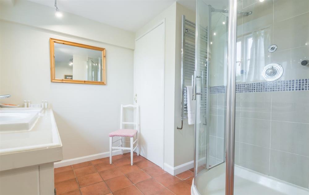 Bathroom with free-standing power shower in House at Bearwood House and Cottage, Pembridge, near Leominster