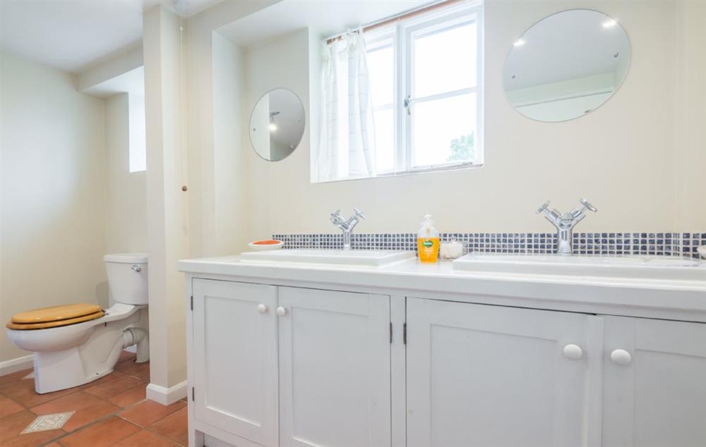 Bathroom with double sink unit at Bearwood House, Pembridge