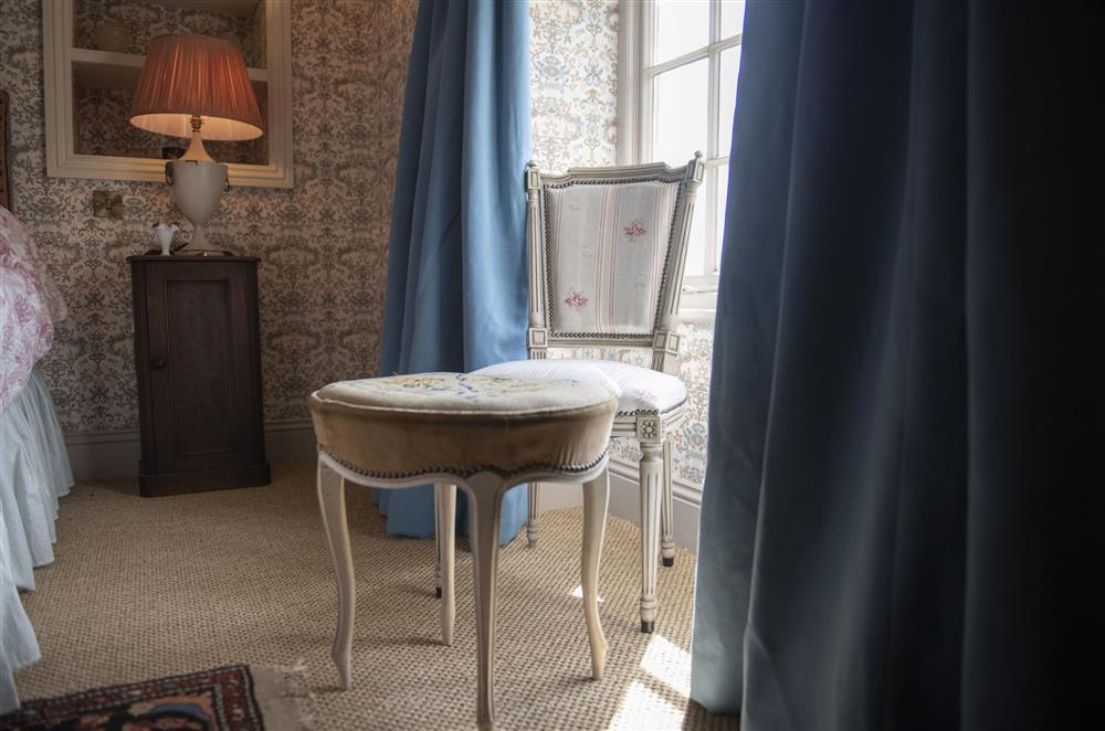 The bedroom is tastefully furnished incorporating vintage pieces at Beau Repaire, Castle Howard, Coneysthorpe
