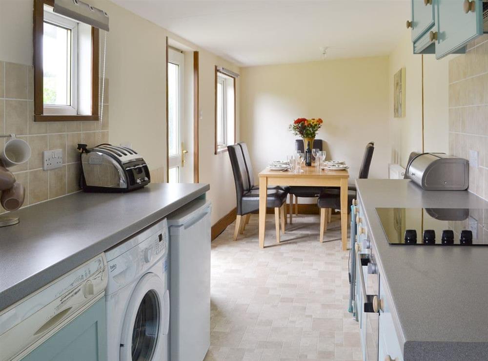 Well-equipped kitchen with dining area at Nursery Cottage, 
