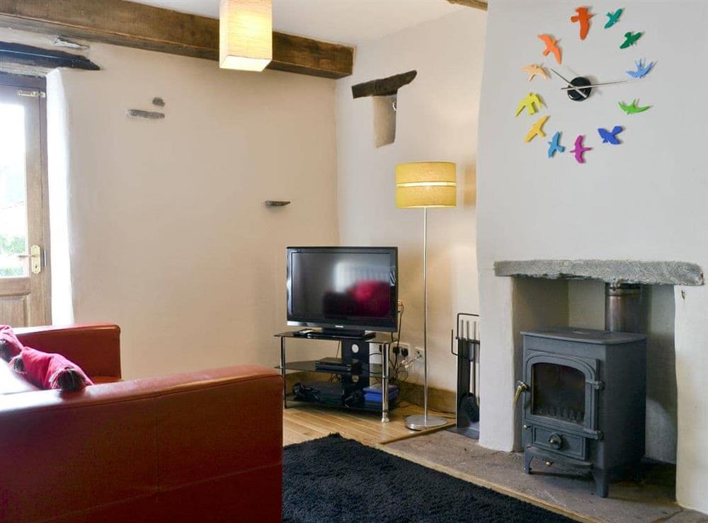 Wonderful, cosy lounge with wood burner at Beck Edge in Braithwaite, Cumbria