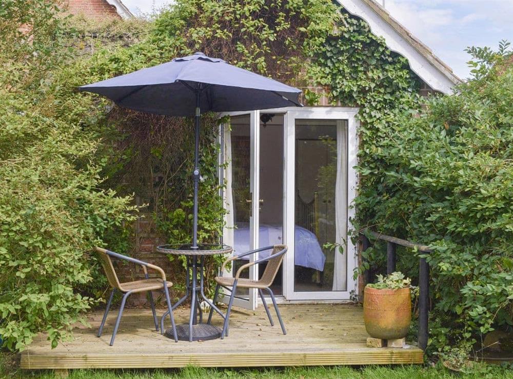 Decked patio within the garden at Beck Gate in Denton, near Bungay, Norfolk