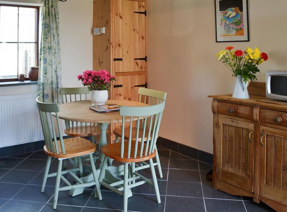 Farmhouse kitchen style dining area at Beckaveans Stable, 