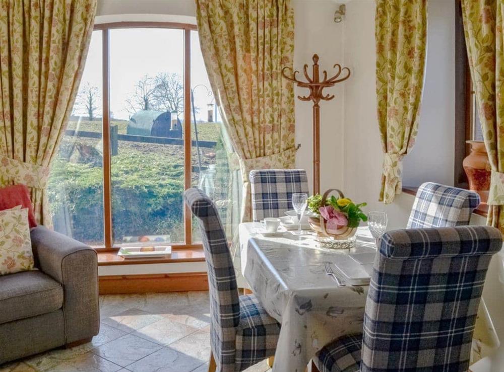 Charming dining area at Beckside in Arkleby, Cumbria