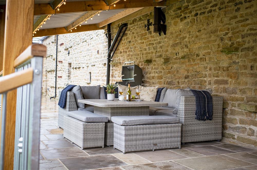 Enjoy a barbecue or two on the covered terrace at Beckside at Ribba Hall Farm, Nr Leyburn, North Yorkshire