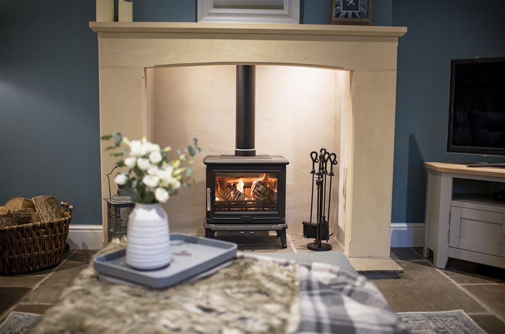 Ground floor: Relax and unwind in front of the cosy wood burning stove  at Beckside at Ribba Hall Farm, Nr Leyburn, North Yorkshire