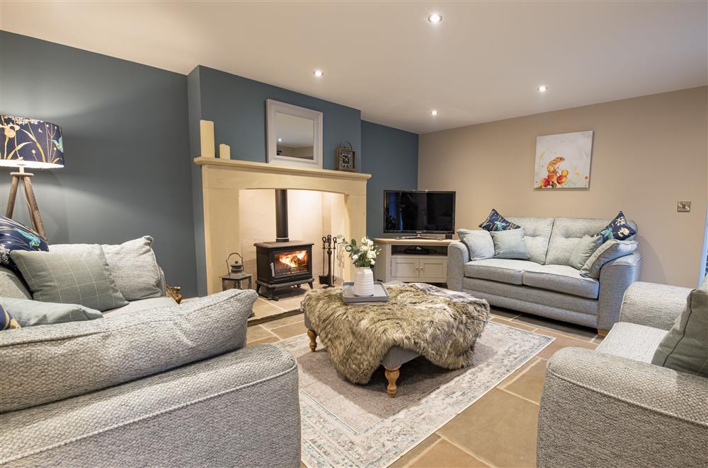 Ground floor: The beautifully furnished sitting room with cosy wood burning stove (photo 2) at Beckside at Ribba Hall Farm, Nr Leyburn, North Yorkshire