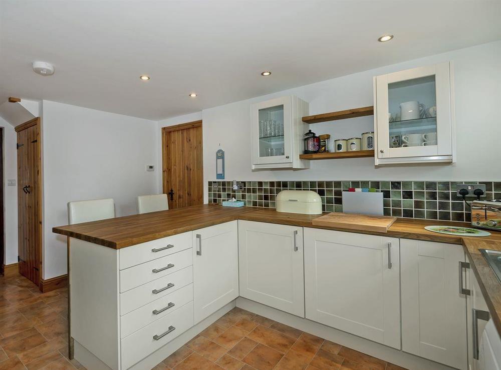 Well equipped kitchen with breakfast area at Beckside Cottage in Orton, near Appleby, Cumbria