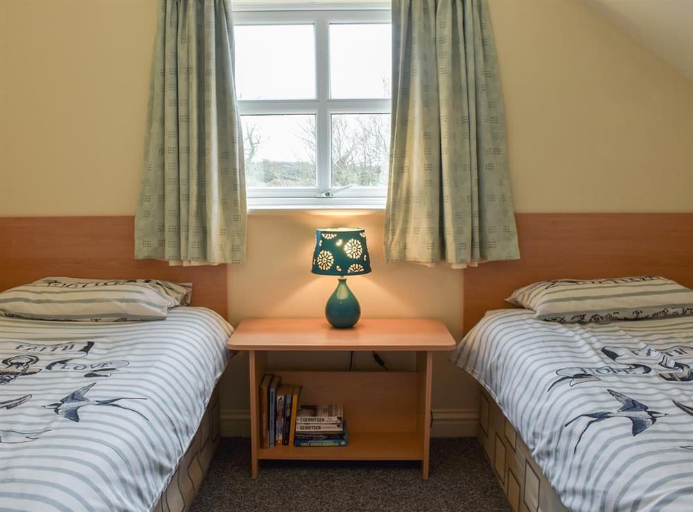 Twin bedroom at Beech Cottage in Benllech, Gwynedd