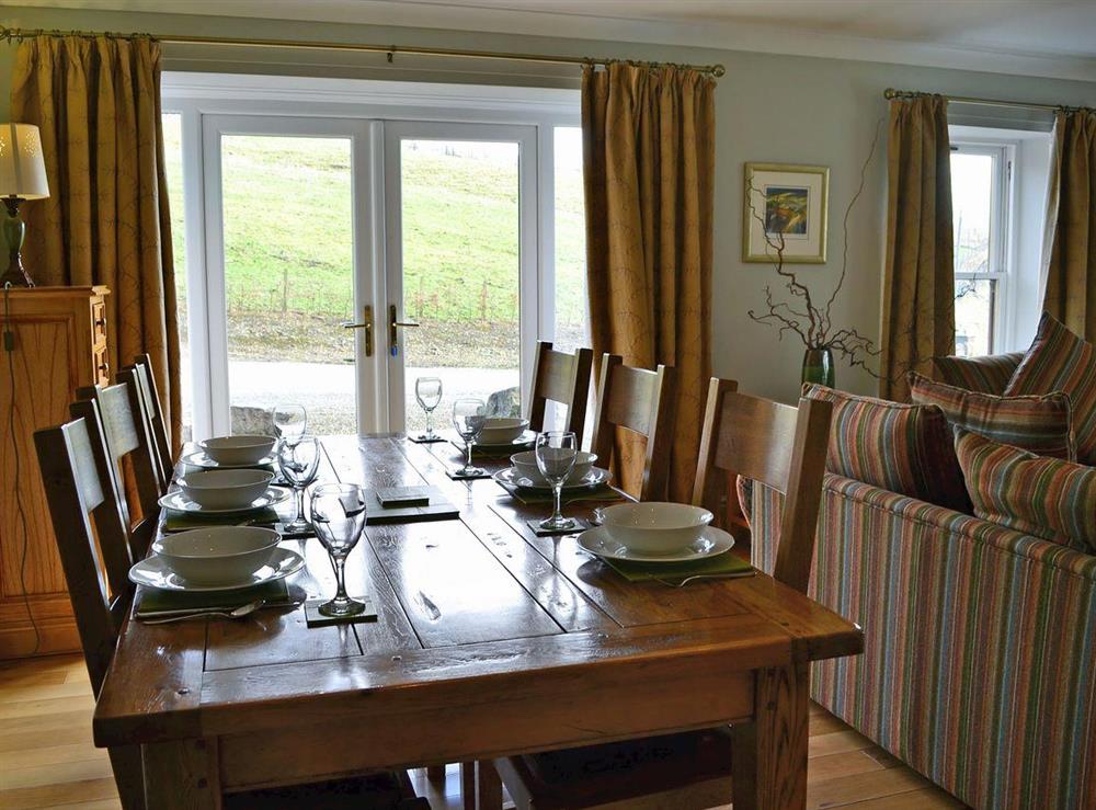 Dining Area with French doors at Beech Cottage in Crawfordjohn, Nr Biggar, S. Lanarkshire., Great Britain