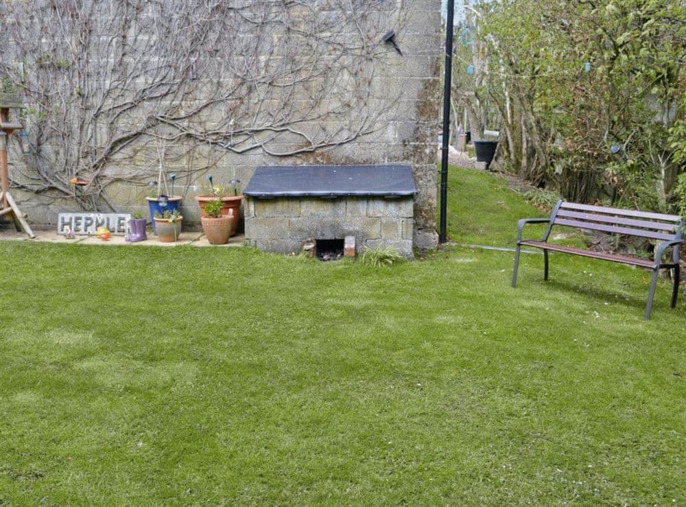 Garden with sitting-out area and furniture at Beech Cottage in Hepple, Northumberland