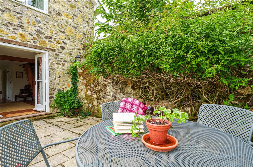 The courtyard garden invites you to enjoy alfresco dining at Beech Cottage, Honiton
