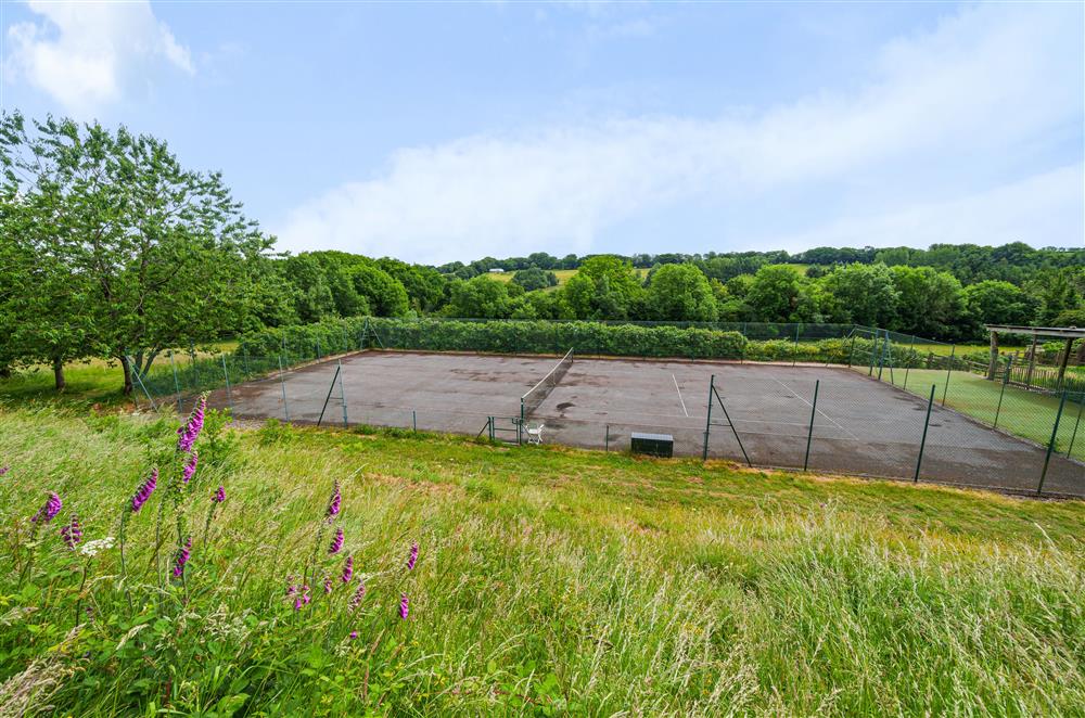The tennis court sits just steps away from the cottage at Beech Cottage, Honiton