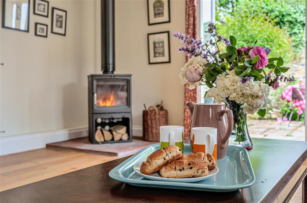 The wood burning stove is ideal for cosy nights together at Beech Cottage, Honiton