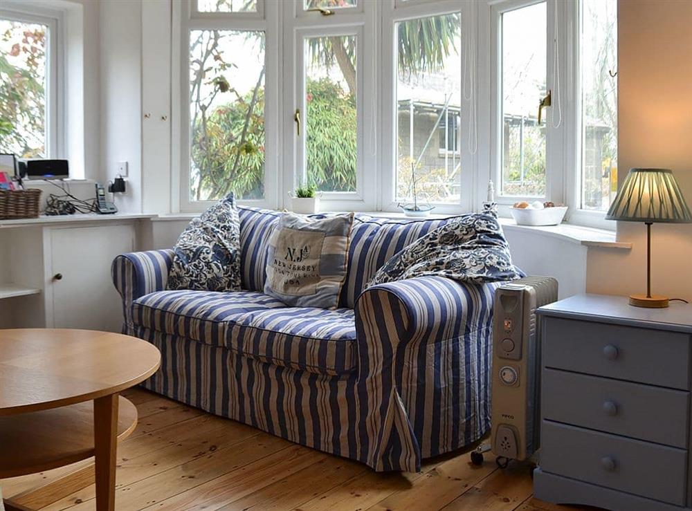 Comfortable living/dining room at Beech Cottage in St Lawrence, near Ventnor, Isle of Wight