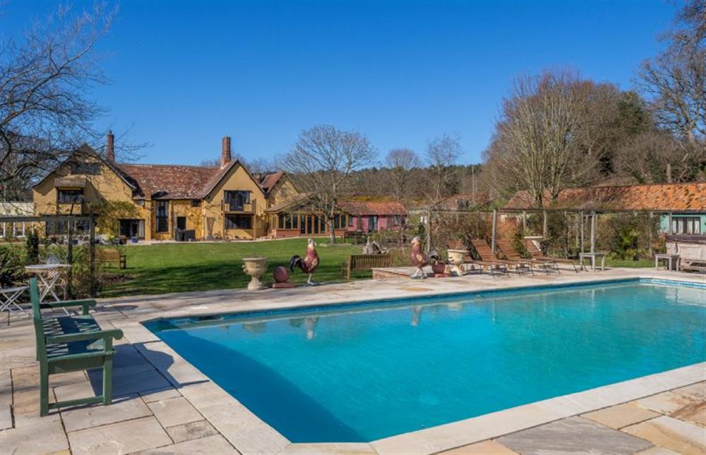 The communal swimming pool with views of Potton Hall at Beech Cottage, Westleton