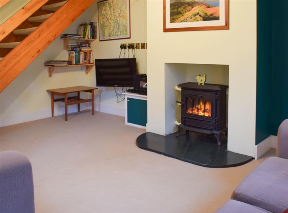 Delightful living room with electric ’woodburner’ at Beech End in Keswick, Cumbria