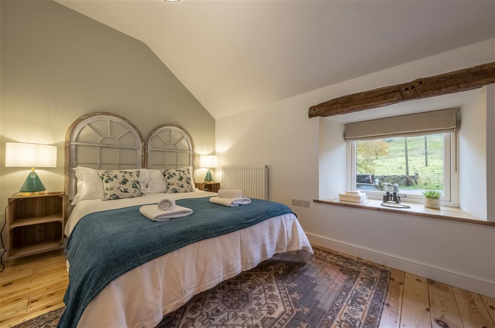 Bedroom two, with a 5’ king-size bed  at Beech Farm Barns, Buxton