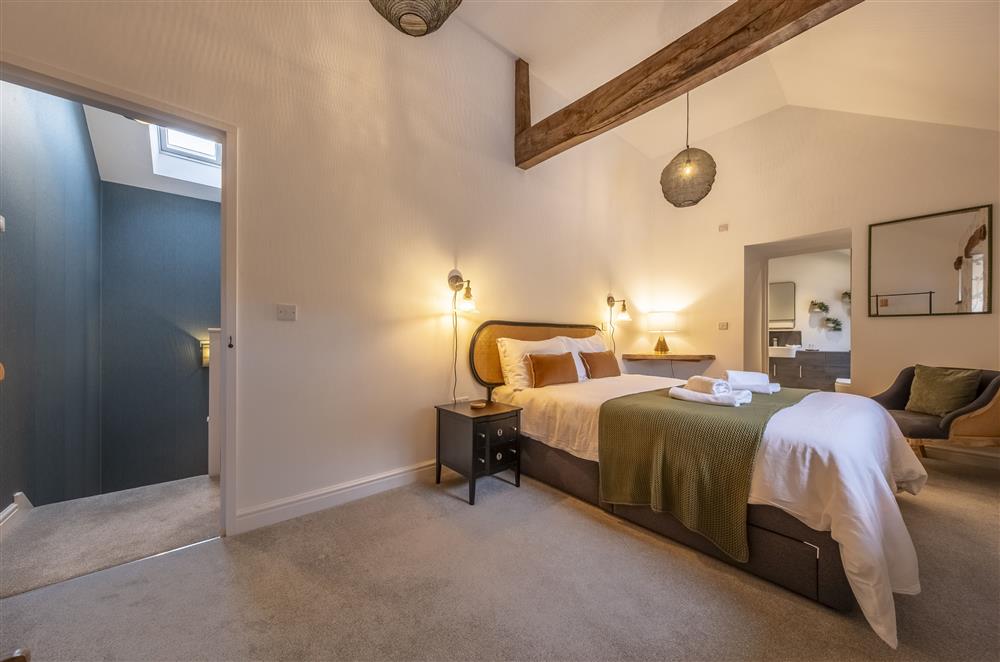 The principle bedroom enjoys an en-suite bathroom  at Beech Farm Barns, Buxton