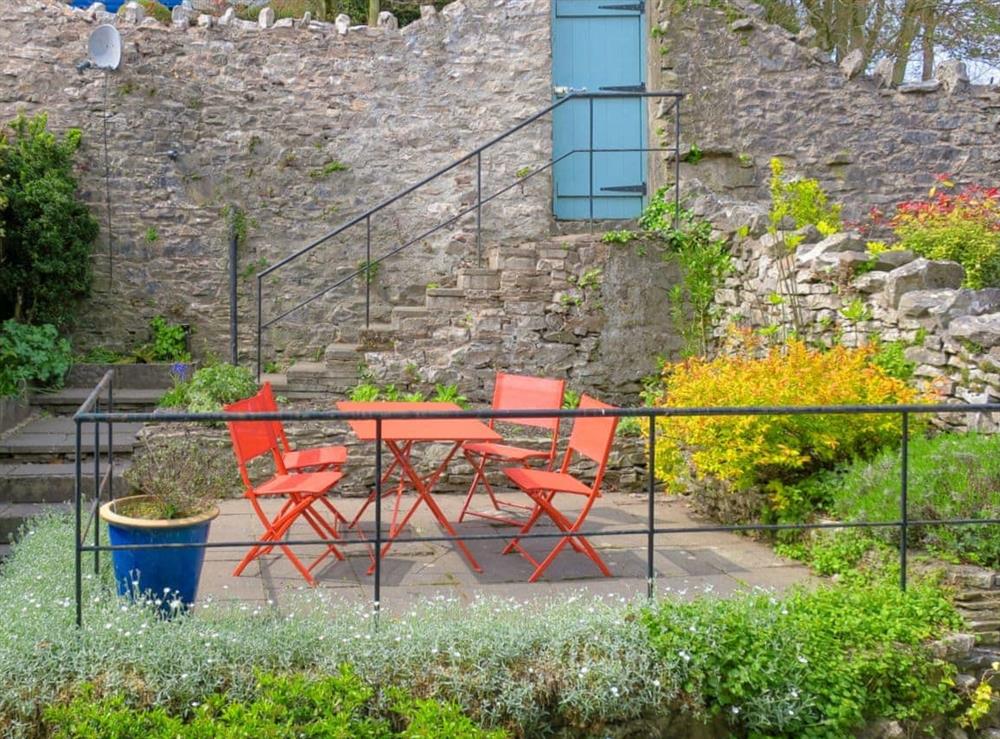Private terraced garden with table and chairs at Beech Hill Terrace in Kendal, Cumbria