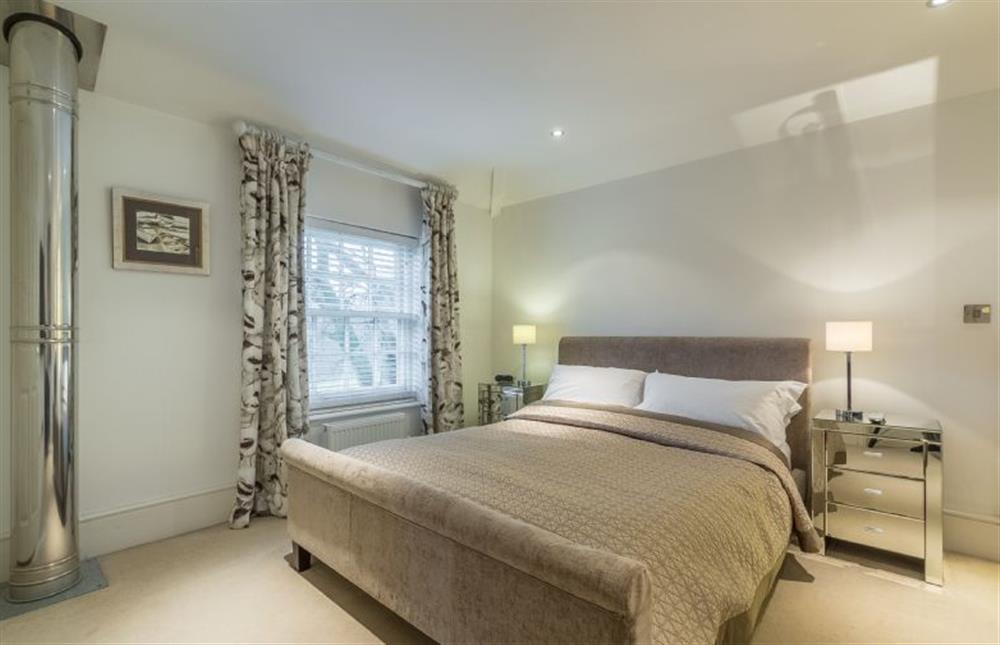 First floor: Master bedroom with king-size bed at Beech House, Little Walsingham