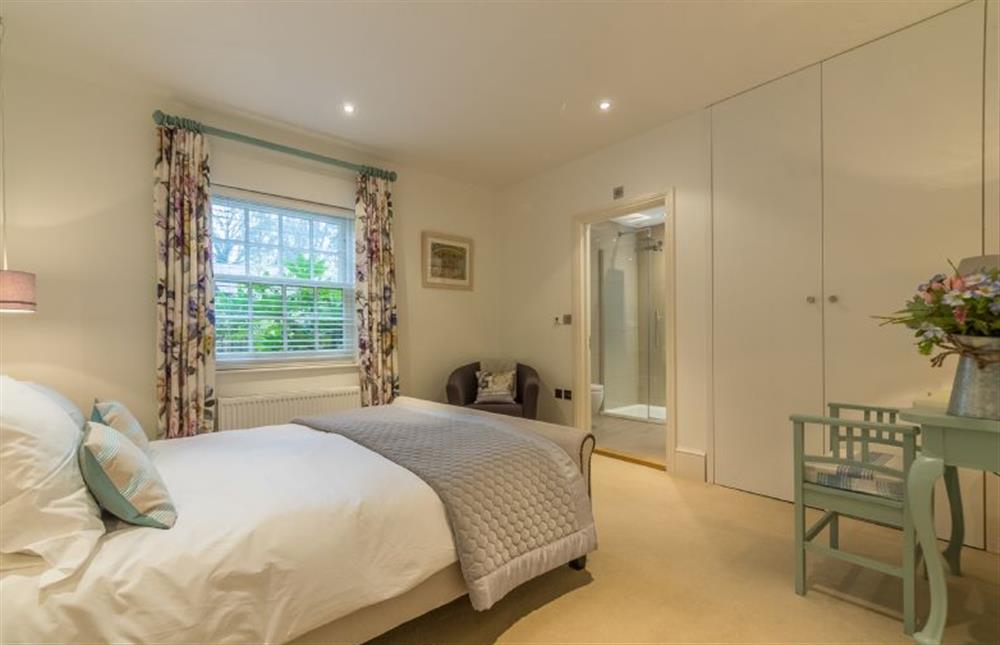 Ground floor: Bedroom two has a king-size bed and en-suite bathroom at Beech House, Little Walsingham