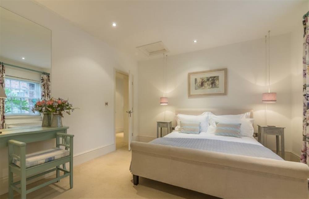 Ground floor: Bedroom two has a king-size bed at Beech House, Little Walsingham